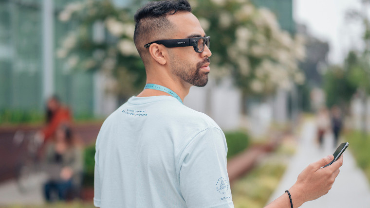 A man wearing Project Aria glasses